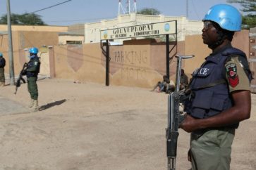 UN peacekeepers stand guard near the airport on February 4, 2016 in Timbuktu, central Mali