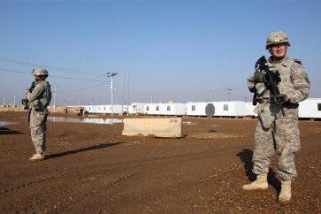 US soldiers walking around at a military base which hosts US troops north of the Iraqi capital Baghdad (photo from 2014)