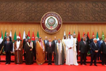 Arab leaders and head of delegations pose for a group photograph during the 28th Ordinary Summit of the Arab League at the Dead Sea