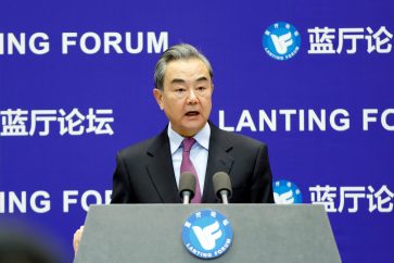 Chinese State Councilor and Foreign Minister Wang Yi delivers a speech at the Lanting Forum in Beijing, China February 22, 2021.  REUTERS/Shubing Wang