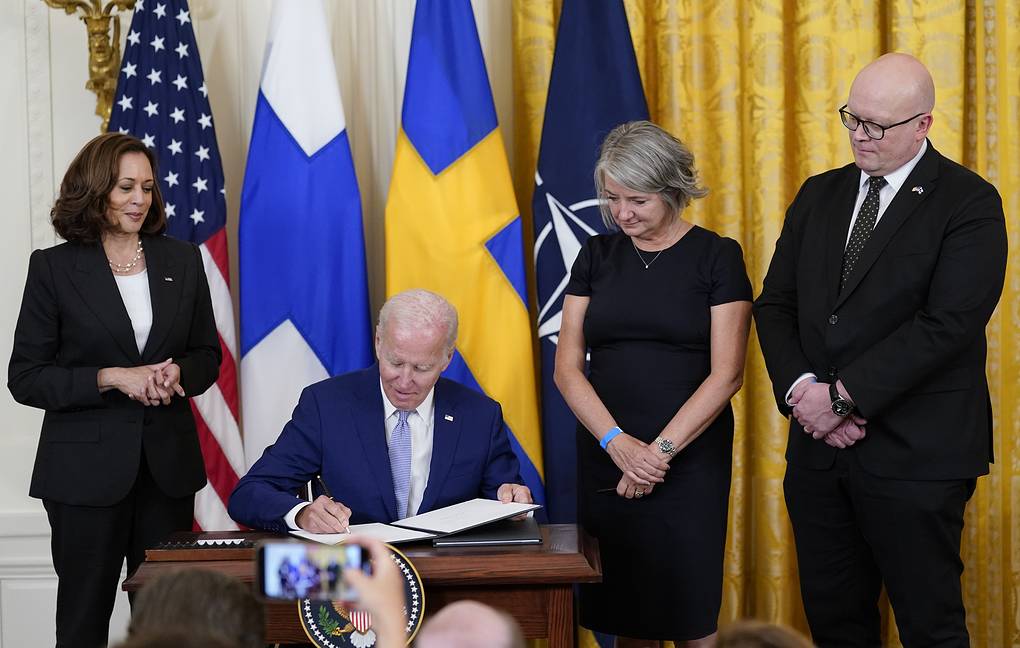 President Joe Biden signs the Instruments of Ratification for the Accession Protocols to the North Atlantic Treaty for the Republic of Finland in the East Room of the White House in Washington, Tuesday, Aug. 9, 2022. The document is a treaty in support of Finland joining NATO. From left, Vice President Kamala Harris, Biden, Karin Olofsdotter, Sweden's ambassador to the U.S., and Mikko Hautala, Finland's ambassador to the U.S. (AP Photo/Susan Walsh)