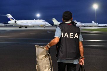 epa10144874 A handout photo made available by the International Atomic Energy Agency (IAEA) shows an IAEA inspection team member on the tarmac as preparations are made for their flight to Ukraine, at Vienna International Airport, Vienna, Austria, 29 August 2022. IAEA Director-General Rafael Grossi leads an IAEA expert mission that comprise IAEA nuclear safety, security, and safeguards staff as they set for their official visit to Ukraine to the Zaporizhzhya Nuclear Power Plant (ZNPP).  EPA-EFE/DEAN CALMA/IAEA / HANDOUT  HANDOUT EDITORIAL USE ONLY/NO SALES