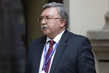 Russia's Governor to the International Atomic Energy Agency (IAEA), Mikhail Ulyanov, has a cigarette break in front of the 'Grand Hotel Wien' where closed-door nuclear talks with Iran take place in Vienna, Austria, Wednesday, May 19, 2021. (AP Photo/Lisa Leutner)
