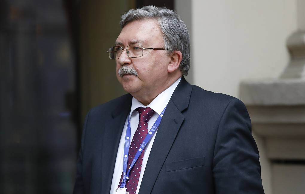 Russia's Governor to the International Atomic Energy Agency (IAEA), Mikhail Ulyanov, has a cigarette break in front of the 'Grand Hotel Wien' where closed-door nuclear talks with Iran take place in Vienna, Austria, Wednesday, May 19, 2021. (AP Photo/Lisa Leutner)