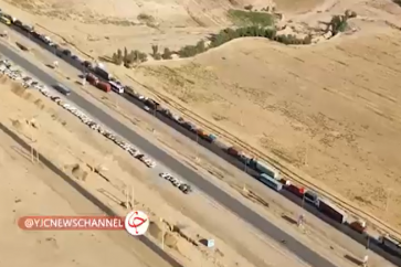 A long queue of Iranian trucks carrying foodstuffs to Holy Karbala City