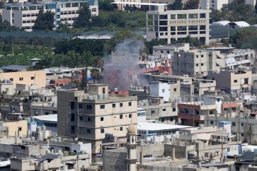 Smoke billows during clashes between Fatah movement and Islamists inside the Ain al-Helweh Palestinian refugee camp, Lebanon's largest Palestinian refugee camp, in the southern coastal city of Sidon on July 31, 2023. At least six people were killed on July 30, in clashes in south Lebanon's restive Palestinian refugee camp, said Palestinian president Mahmud Abbas's Fatah movement and a source at the camp. (Photo by Mahmoud ZAYYAT / AFP)