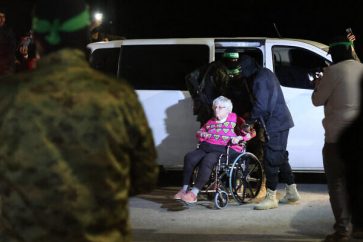Israeli captive being released by Hamas and Islamic Jihad fighters at Rafah Crossing during the fifth release on Tuesday, November 28, 2023.