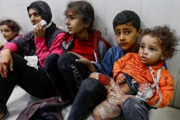 Injured Palestinians at Al-Nasser Hospital following an Israeli airstrike in Khan Yunis (December 10, 2023).